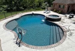 This pool & spa combo features a vinyl covered step entry with a basketball hoop in the shallow end, a side sun ledge for relaxing and a diving board in the deep end 